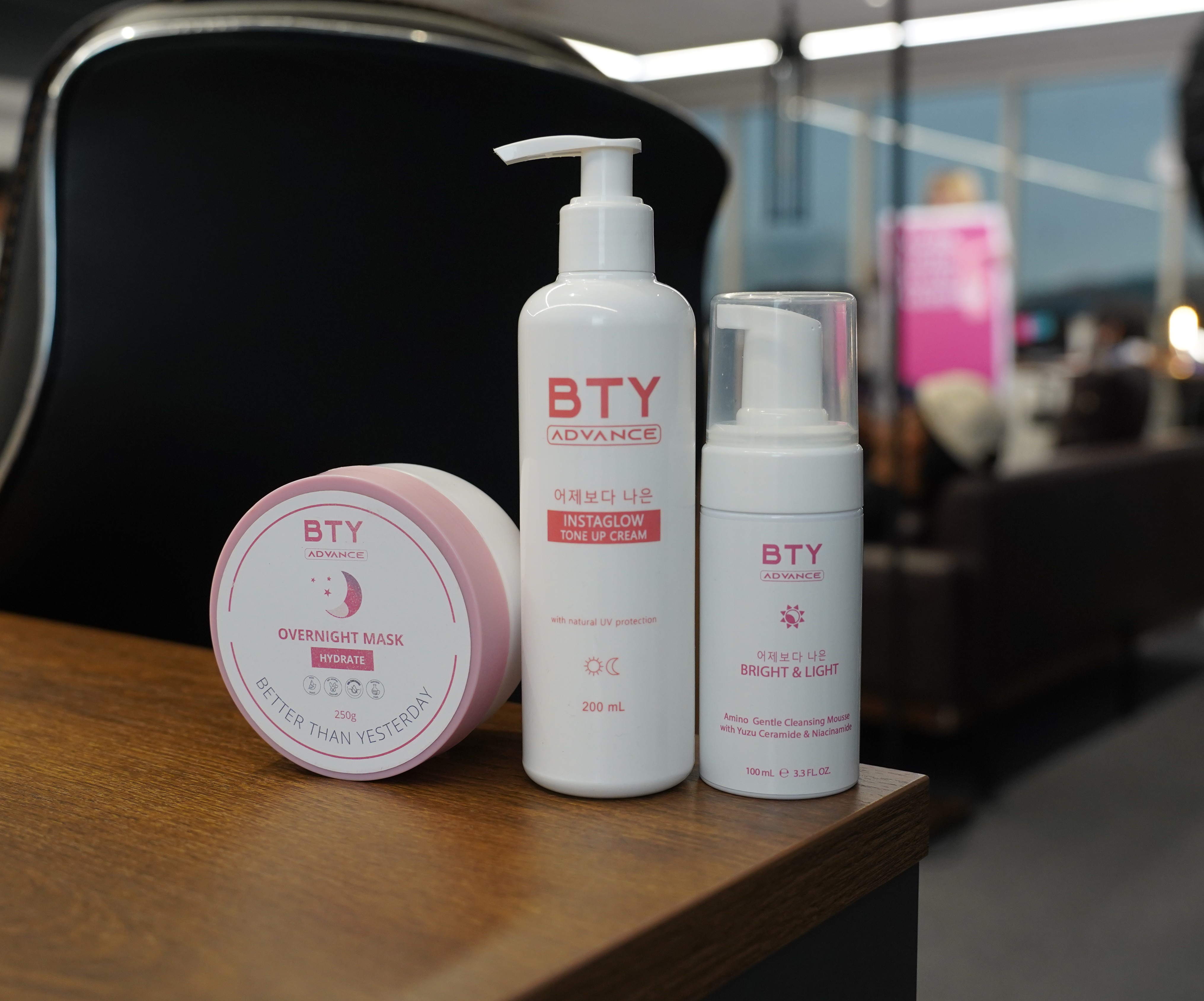 BTY overnight mask, BTY advance lotion for varicose veins and Bright and Light displayed on desk