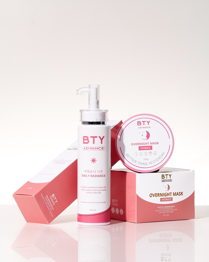BTY Advance Daily Radiance and Overnight Mask on a dark table with a city view