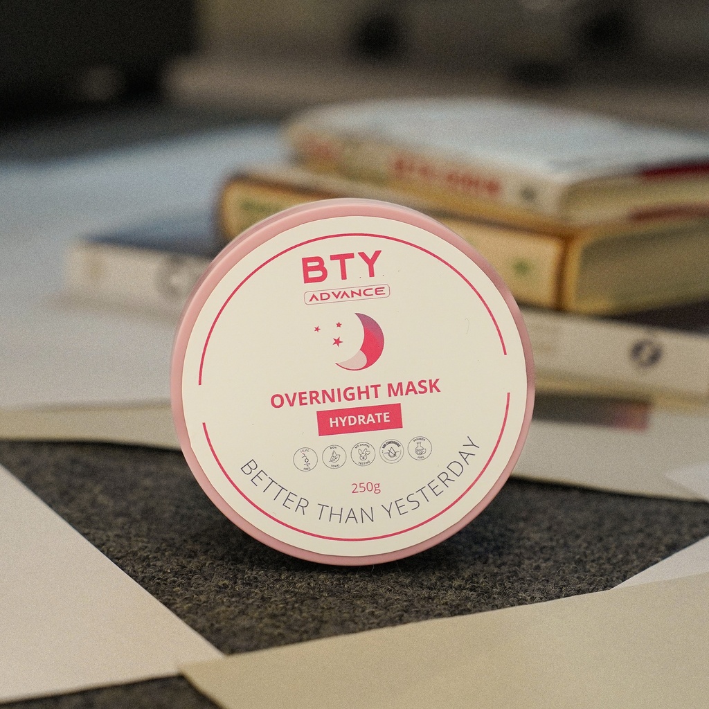 BTY Advance Overnight Mask on a stack of books